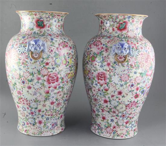 A pair of Chinese thousand flower baluster vases, Republic period, height 40cm excl. wood stands